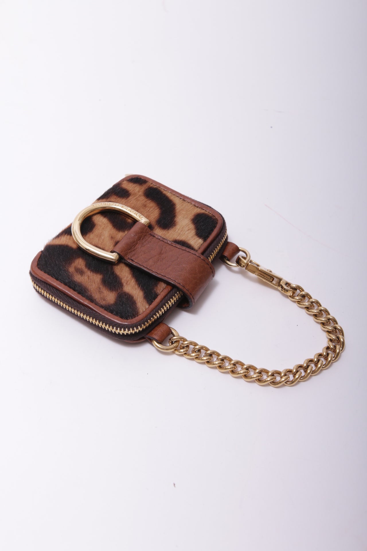 Dolce and Gabbana mini bag charm in leopard furry leather