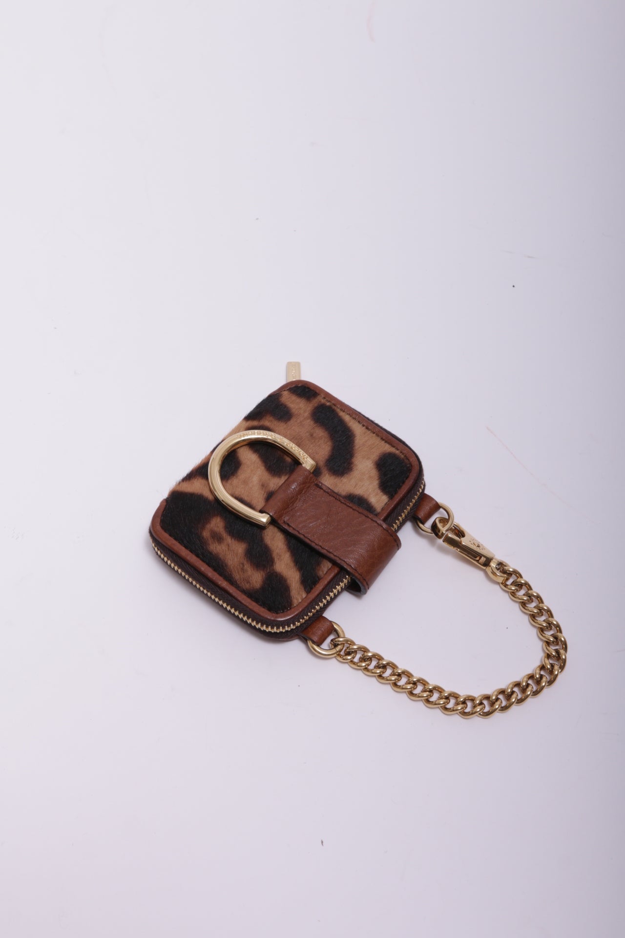 Dolce and Gabbana mini bag charm in leopard furry leather