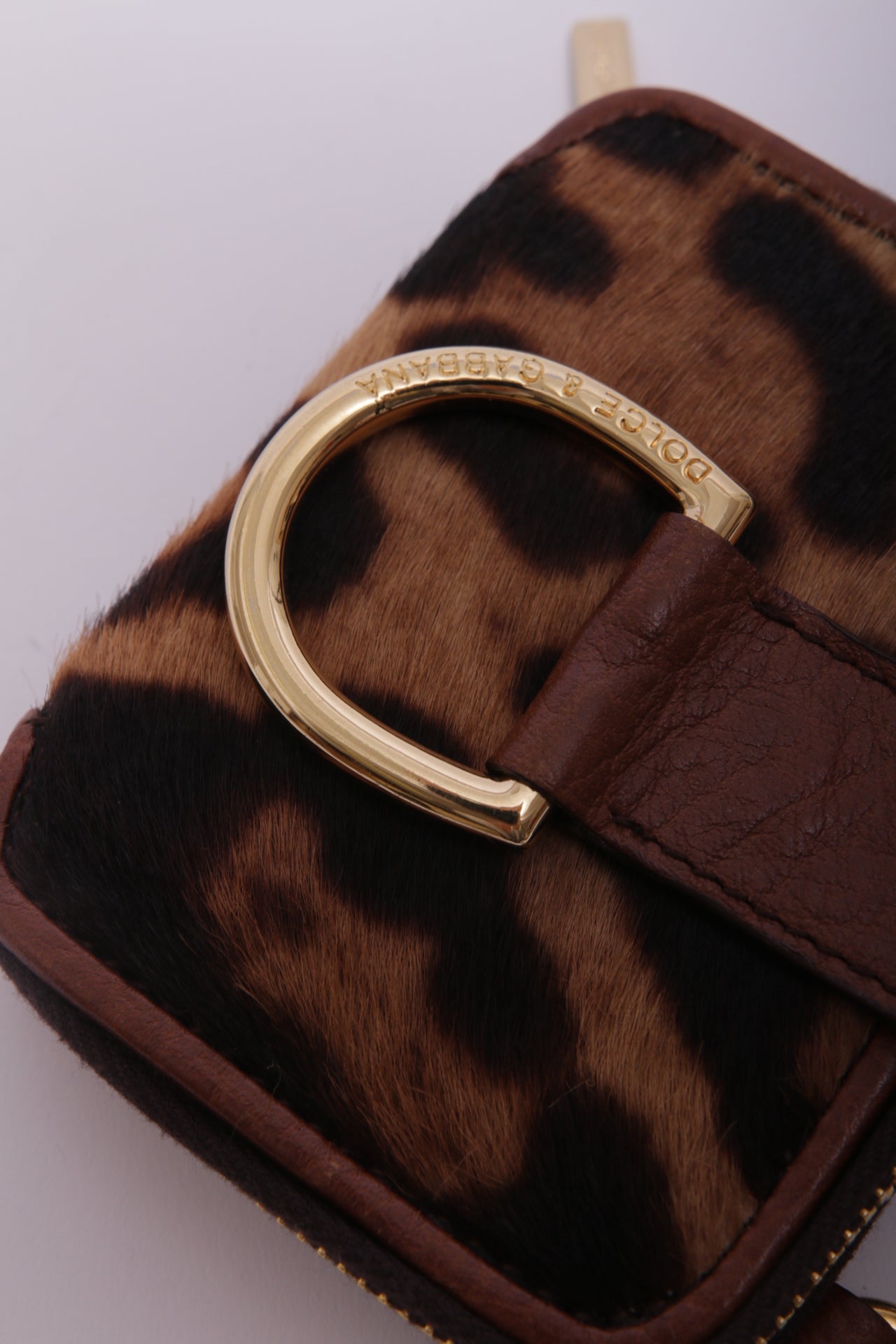 Dolce and Gabbana mini bag charm in leopard furry leather