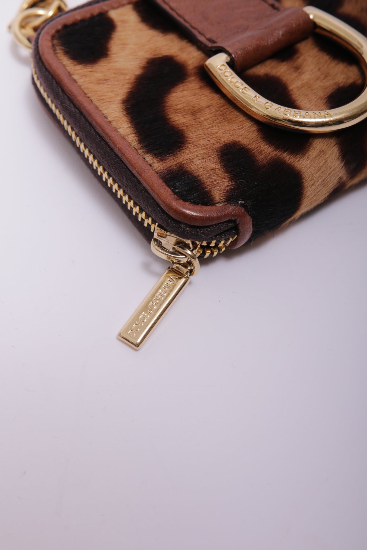 Dolce and Gabbana mini bag charm in leopard furry leather