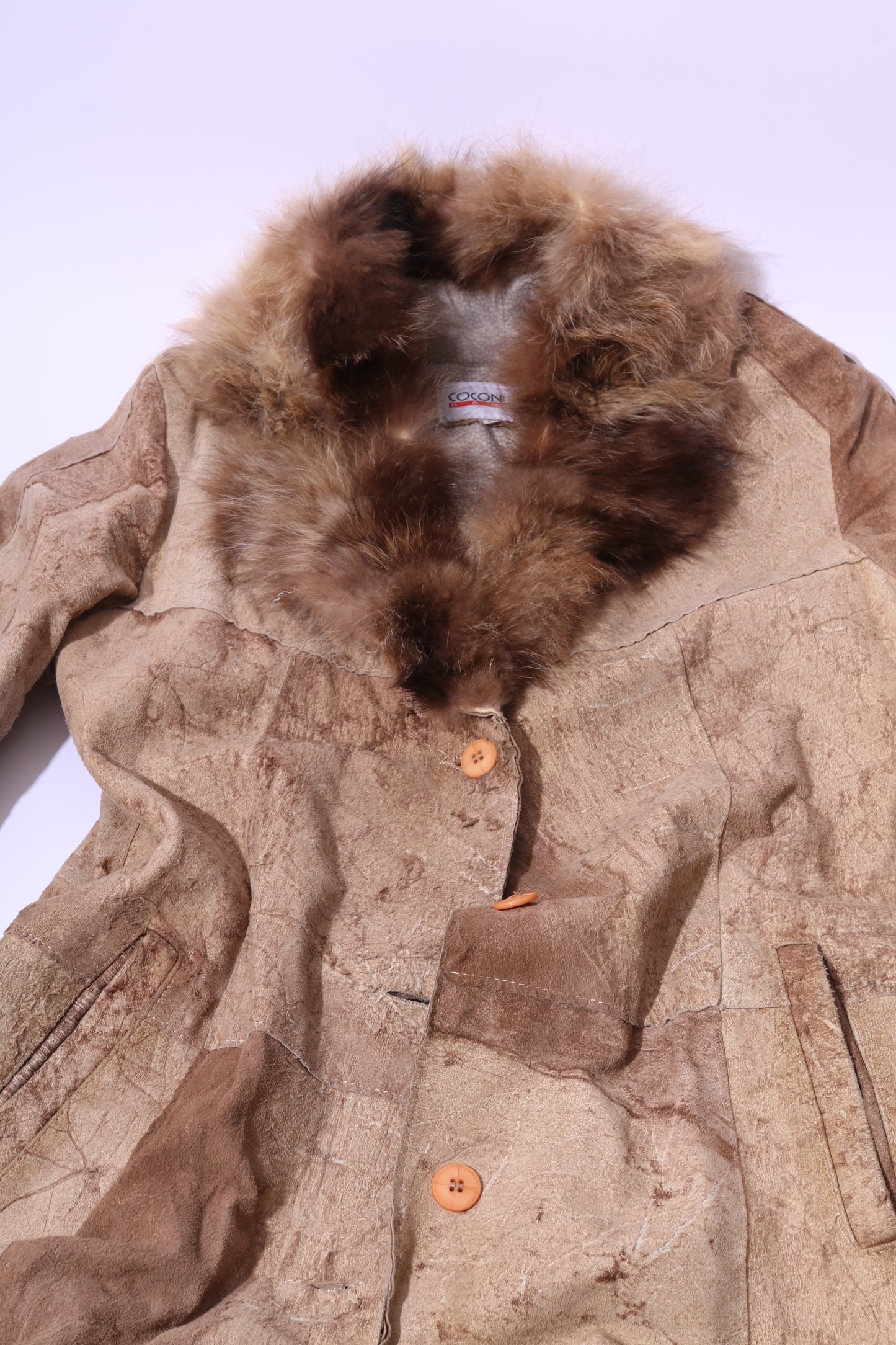 Extra long discarded leather coat with fur collar