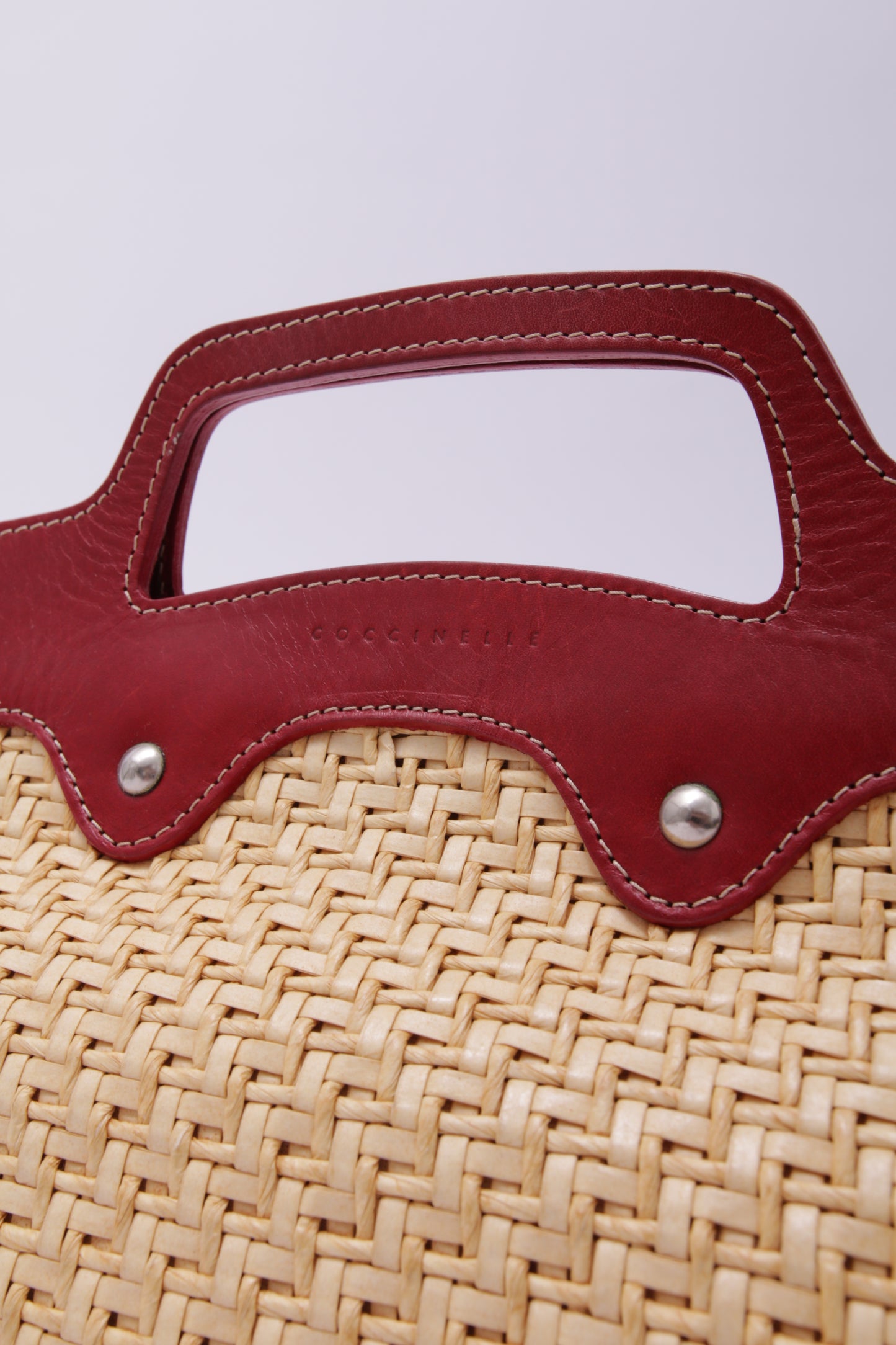 COCCINELLE red leather and straw handbag