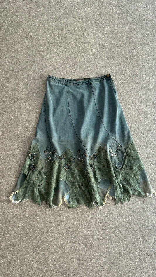 Mid-length denim spiral skirt with lace and beads application