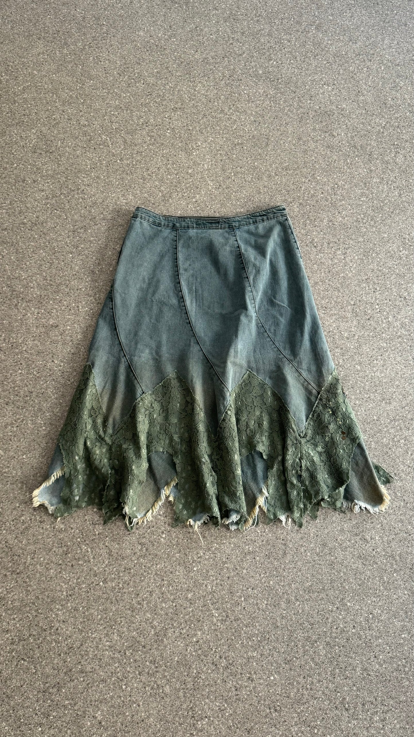 Mid-length denim spiral skirt with lace and beads application